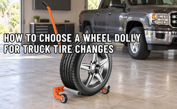 Truck wheel dolly holding a wheel in a garage.