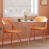 Set di 4 sedie pieghevoli Garvee con comode sedute, struttura in acciaio, impilabili, capacità di carico di 350 kg, arancione, per uso interno ed esterno