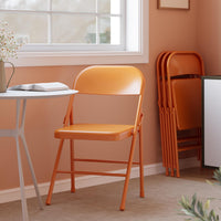 Set di 4 sedie pieghevoli Garvee con comode sedute, struttura in acciaio, impilabili, capacità di carico di 350 kg, arancione, per uso interno ed esterno