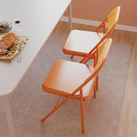 Set di 4 sedie pieghevoli Garvee con comode sedute, struttura in acciaio, impilabili, capacità di carico di 350 kg, arancione, per uso interno ed esterno